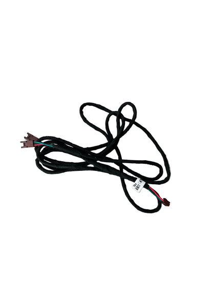 Black electrical wire harness on a wooden floor
